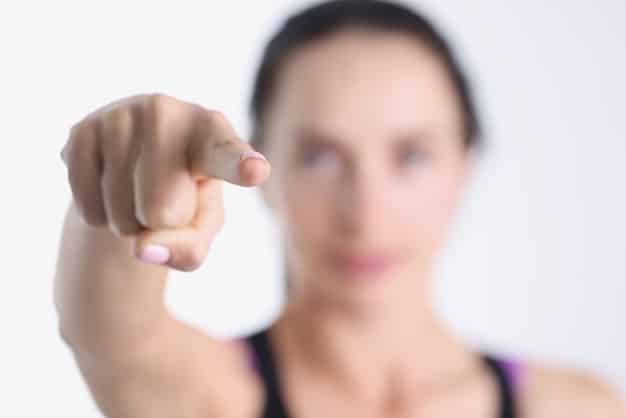 A close-up image of a person's finger pointing to the 