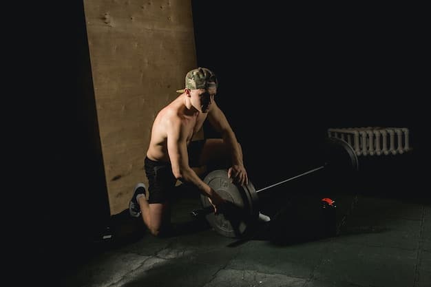 An athlete performing a heavy squat, showcasing proper form and intensity in a gym, with focus on muscles engaged and concentration.