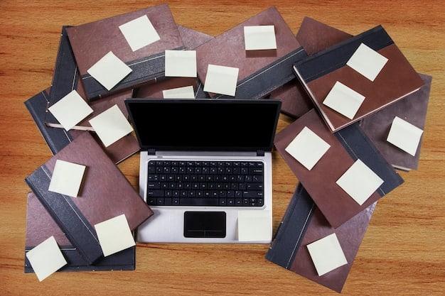 A detailed flat lay of a cluttered desk with design software open on a laptop, various label mockups, and regulatory guidelines documents, illustrating the complexity of compliance.