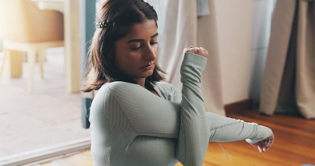 A person stretching gently after a light workout, focusing on body awareness and flexibility as part of recovery.
