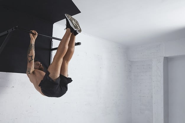 A person performing a dead hang on a pull-up bar, with a clear view of their hands gripping the bar tightly and their back muscles engaged.