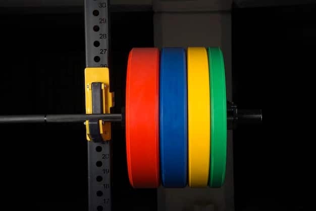 A detailed shot of Olympic weight plates stacked on a barbell with a male lifter in the background, showcasing the concept of weight progression or regression in pyramid training.