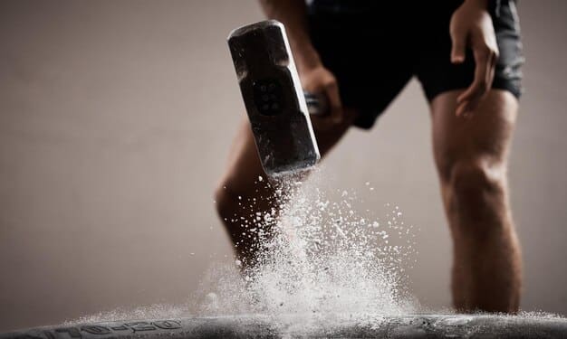 A detailed close-up of an athlete's legs and feet pushing off the ground, showcasing muscle definition and the explosive power generated during the initial phase of a vertical jump.