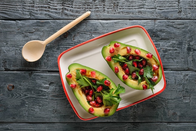 A vibrant, colorful vegan meal prep container filled with quinoa, black beans, corn, bell peppers, and avocado, showcasing a balanced and protein-rich plant-based diet.