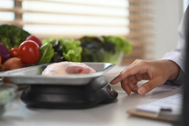 A person's hands holding a food scale, weighing a portion of chicken and vegetables, illustrating precise meal prep and portion control.