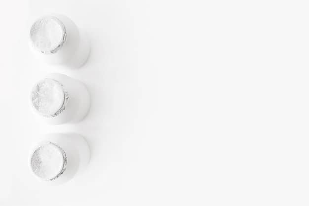 A minimalist flat lay of various protein powders, a shaker bottle, and omega-3 capsules, arranged neatly on a clean surface.