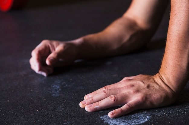 A detailed close-up of a weightlifter's hands gripping a barbell, showcasing chalk dust and muscular forearm definition. The focus is on the effort and grip strength involved in lifting.