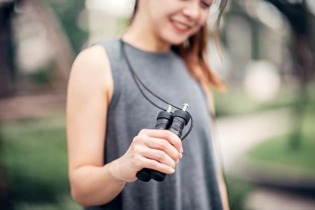 A person's hand holding a protein shake shaker bottle after a workout, with gym equipment blurred in the background, symbolizing post-workout recovery and nutrient timing.