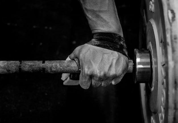 A close-up of a powerlifter's hands gripping a barbell tightly, showing chalked hands and focused intensity before a heavy lift.